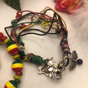 5.).2 RASTA FARI BEADED AND STRING BRACELET WEED CHARMS
